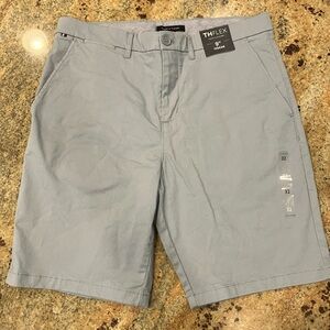 Men’s Tommy Hilfiger 32 inch, 9 inch inseam light blue shorts , NWT. Flat front